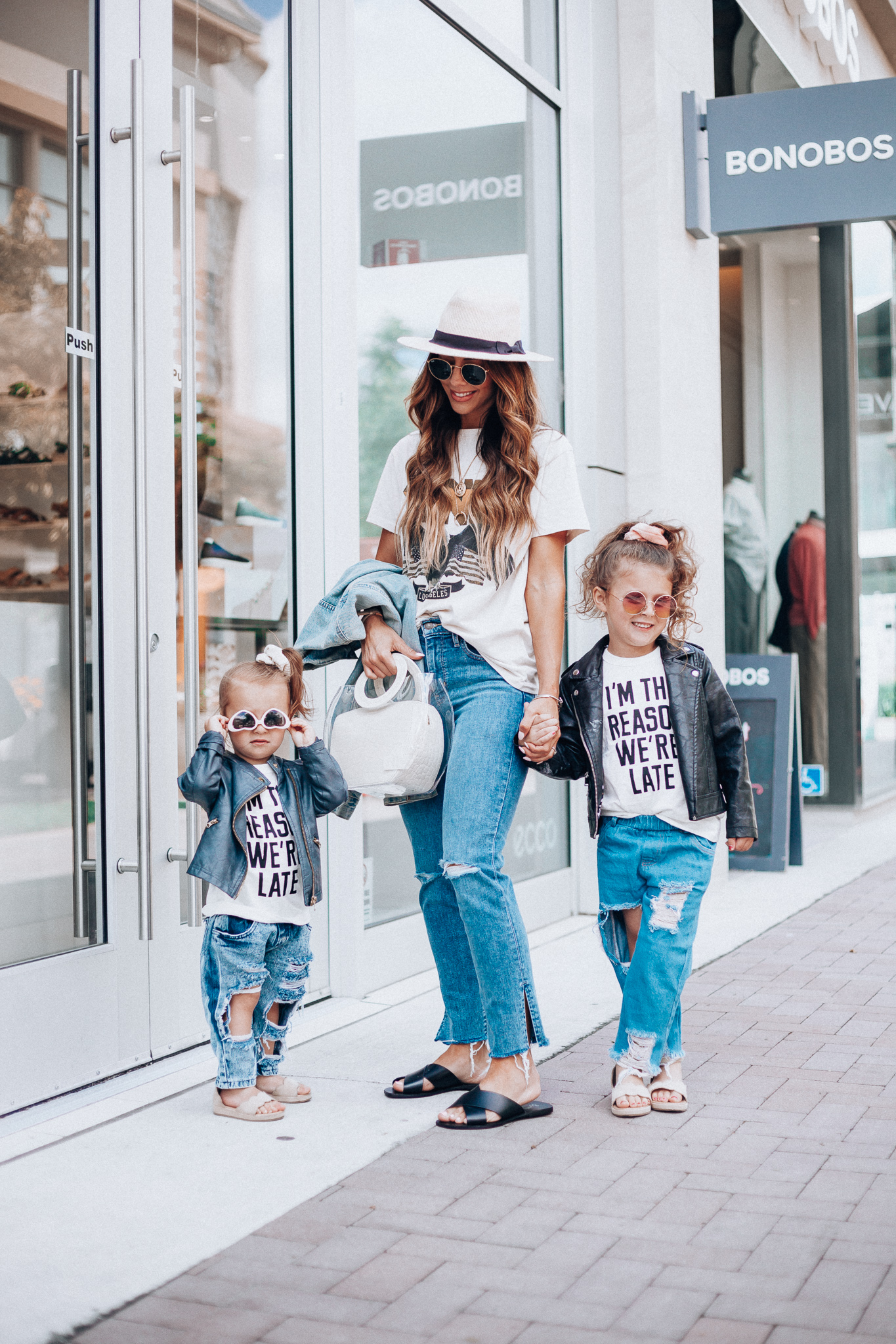 Cute Graphic Tees featured by top US fashion blog The Girl in the Yellow Dress; Image of a woman wearing a graphic tee and jeans.