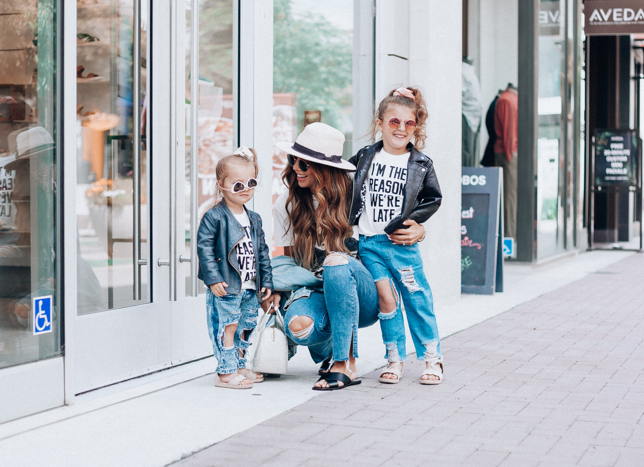 Cute Graphic Tees featured by top US fashion blog The Girl in the Yellow Dress; Image of a woman wearing a graphic tee and jeans.