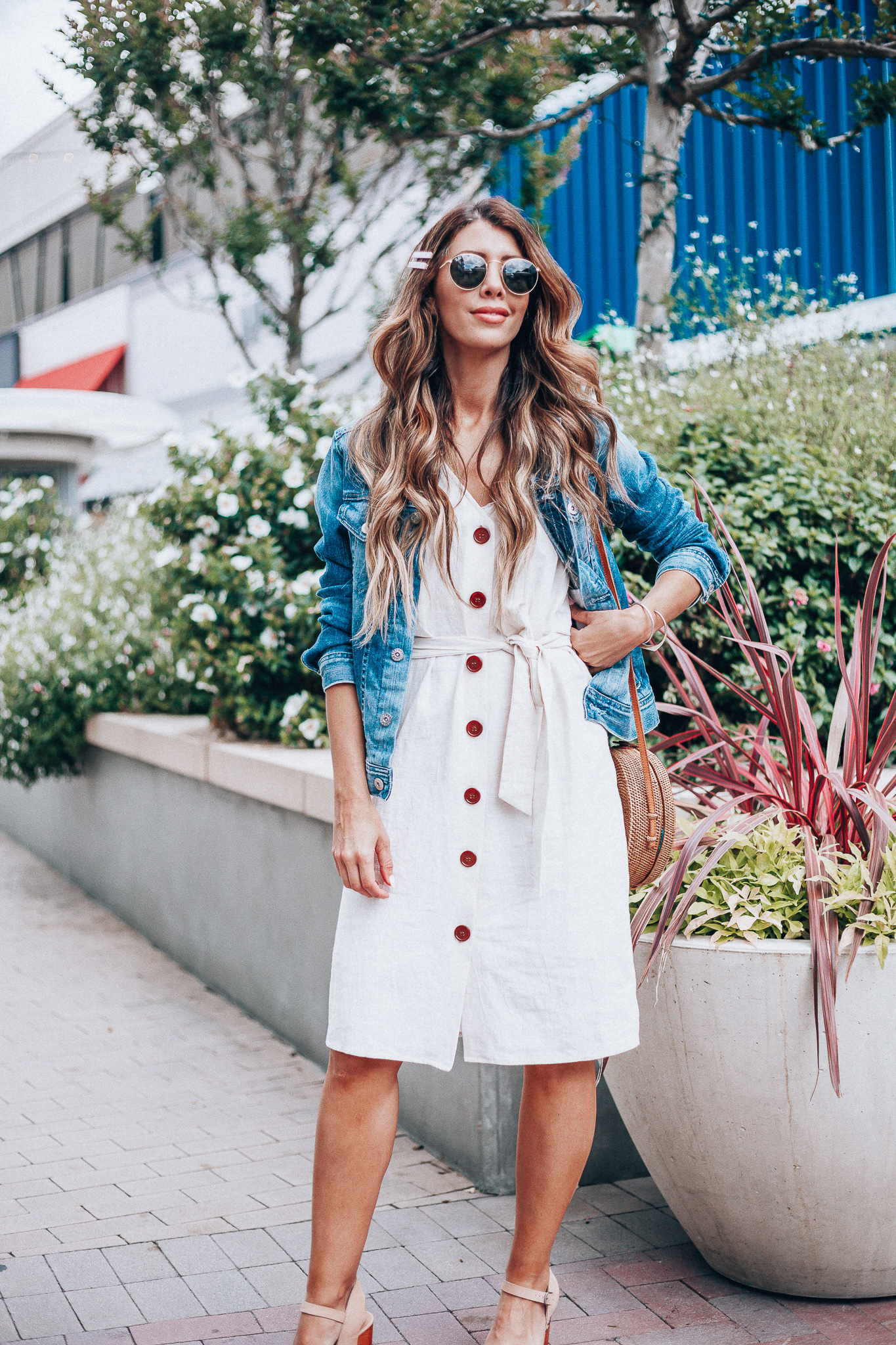 Cute Summer Dresses featured by top US fashion blog The Girl in the Yellow Dress; Image of a woman wearing Evereve denim jacket, Nordstrom button down dress and Evereve wedges.