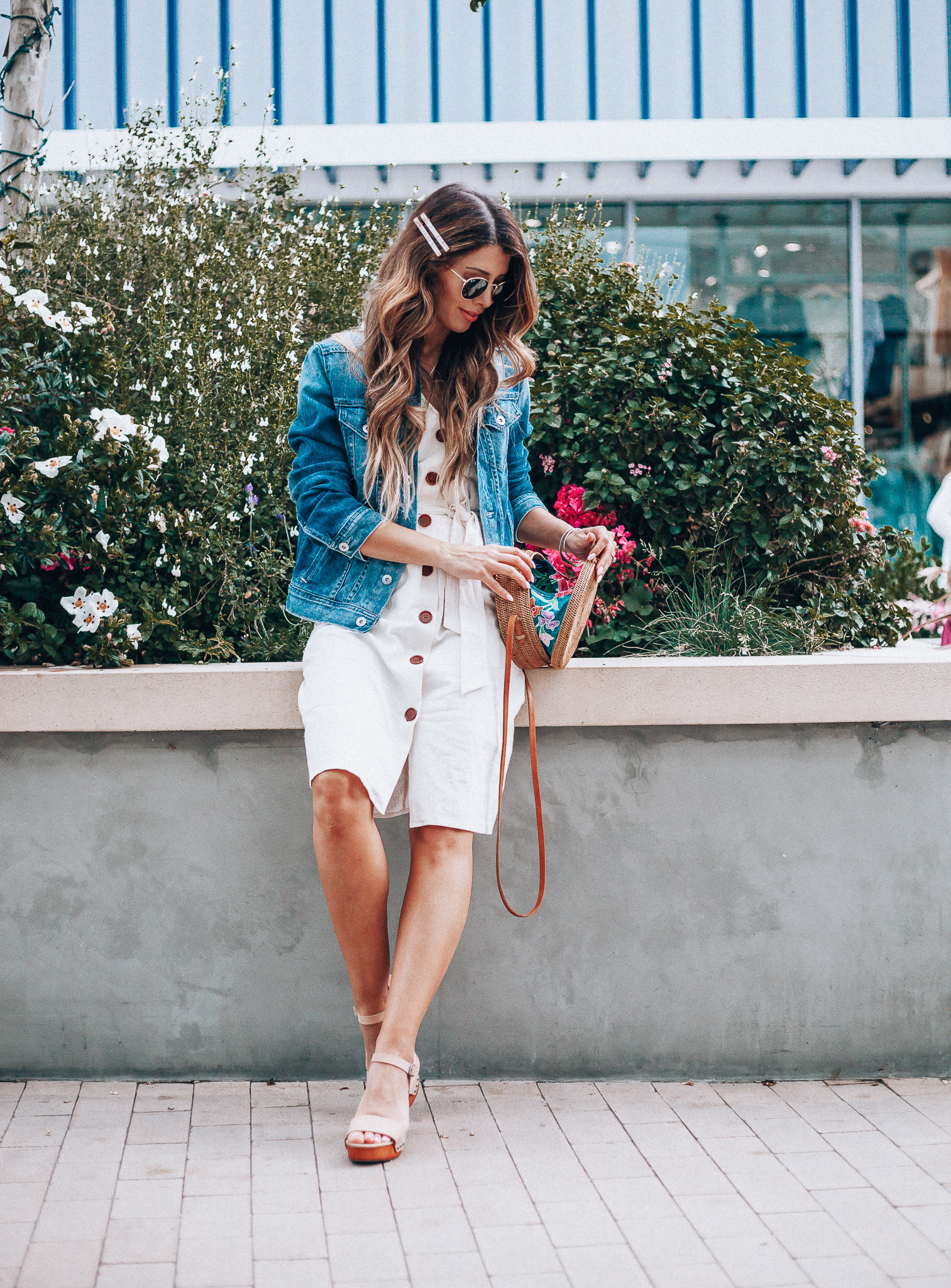 Cute Summer Dresses featured by top US fashion blog The Girl in the Yellow Dress; Image of a woman wearing Evereve denim jacket, Nordstrom button down dress and Evereve wedges.