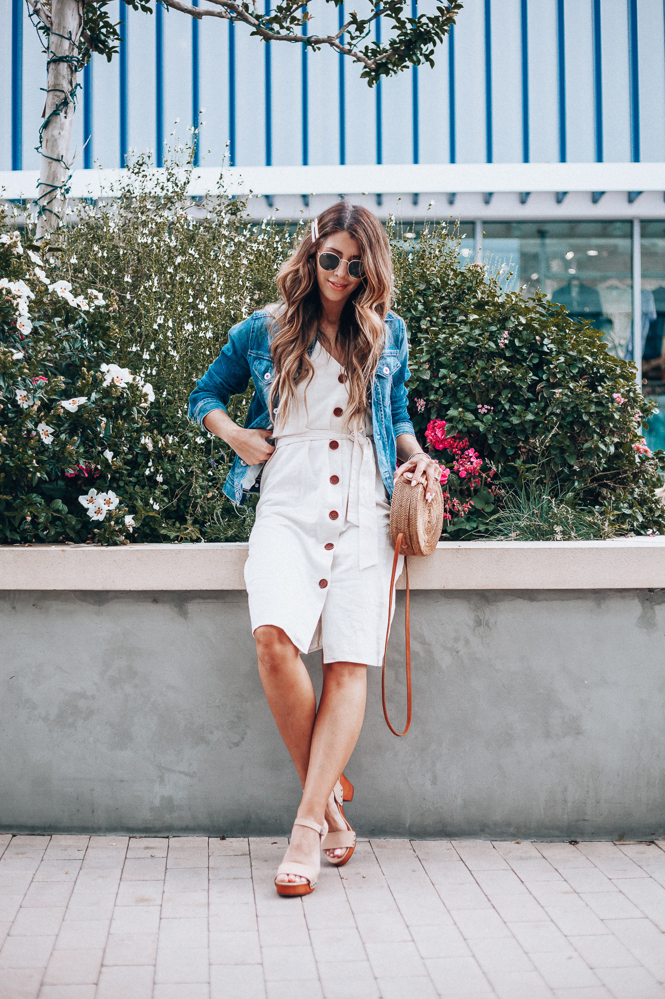 Cute Summer Dresses featured by top US fashion blog The Girl in the Yellow Dress; Image of a woman wearing Evereve denim jacket, Nordstrom button down dress and Evereve wedges.