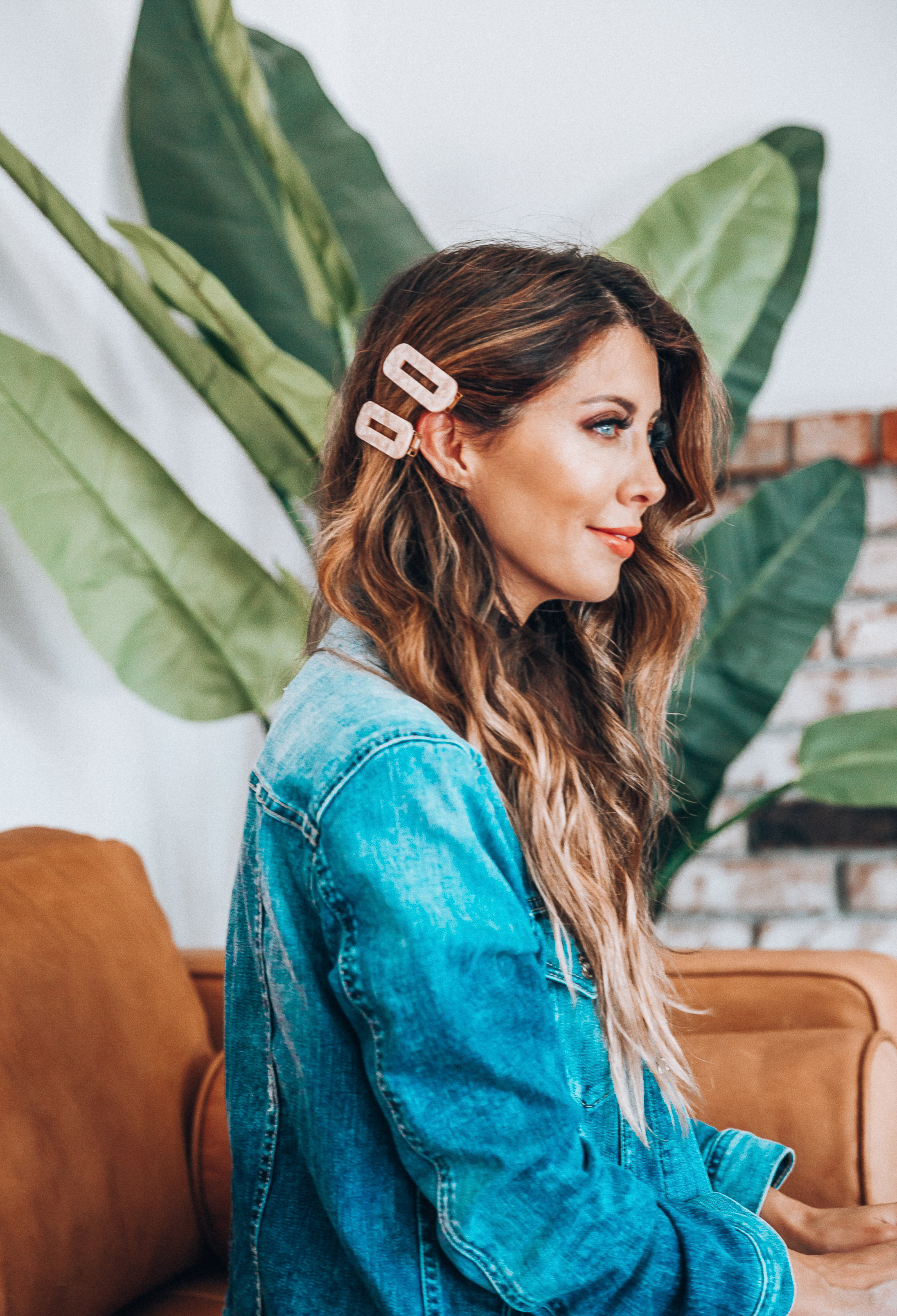 Hair Accessories for Long Hair featured by top US fashion blog The Girl in the Yellow Dress; Image of a woman wearing a denim jacket.