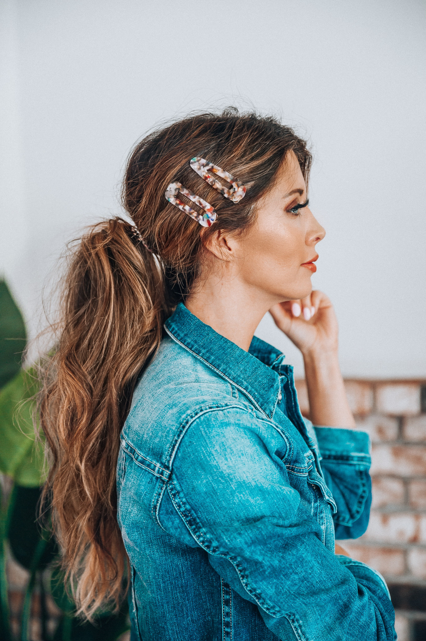 Hair Accessories for Long Hair featured by top US fashion blog The Girl in the Yellow Dress; Image of a woman wearing a denim jacket.