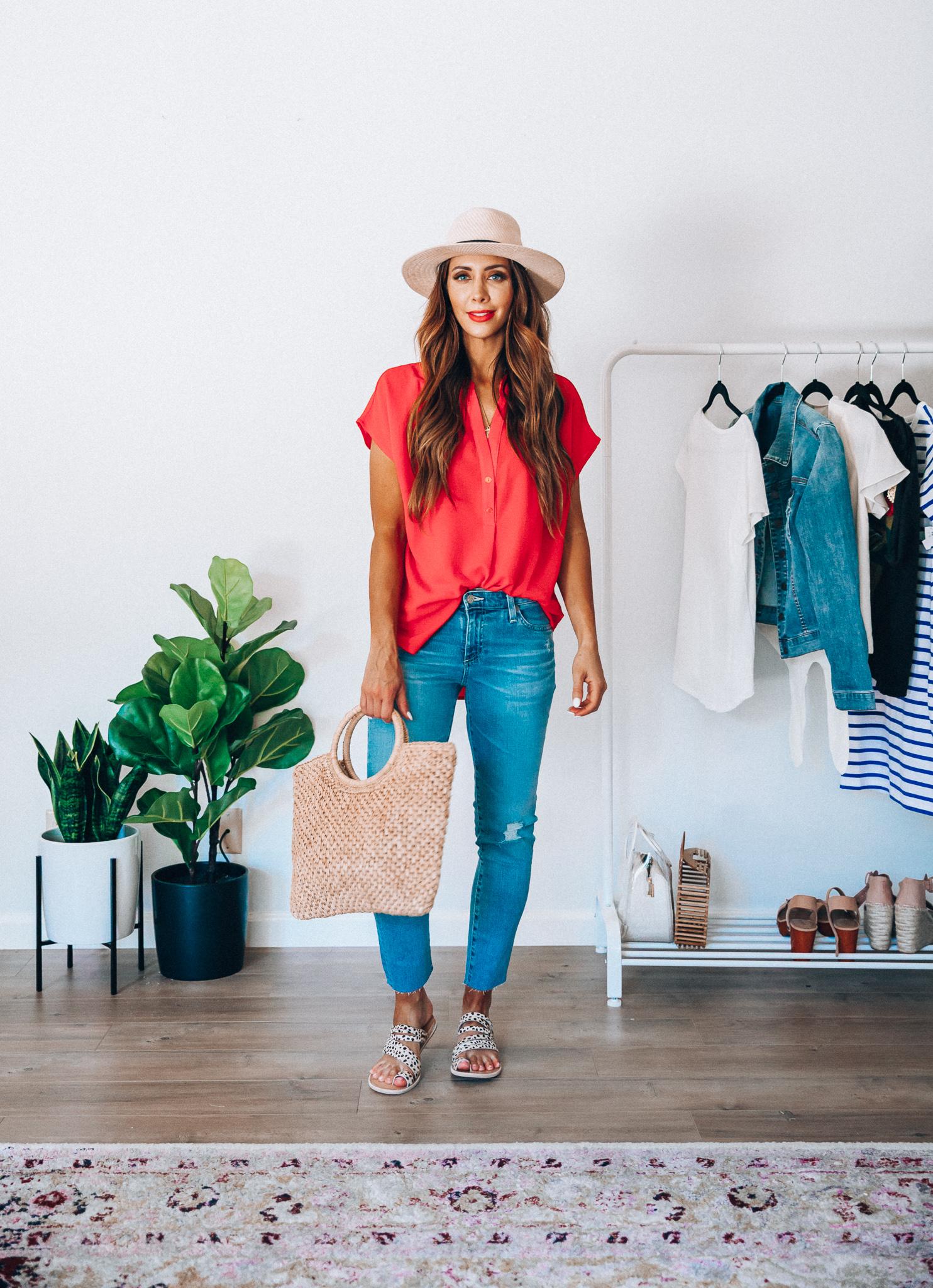 Summer Try On: Evereve Favorites by popular San Francisco fashion blog, The Girl in the Yellow Dress: image of a woman wearing a Evereve red Allison Joy Amelia Popover Top, Evereve Ag Prima Crop jeans, Evereve Dolce Vita Nelly Leopard Slide, Nordstrom Panama Hat by SOLE SOCIETY, and holding a Shopbop Hat Attack Small Round Handle Bag. 