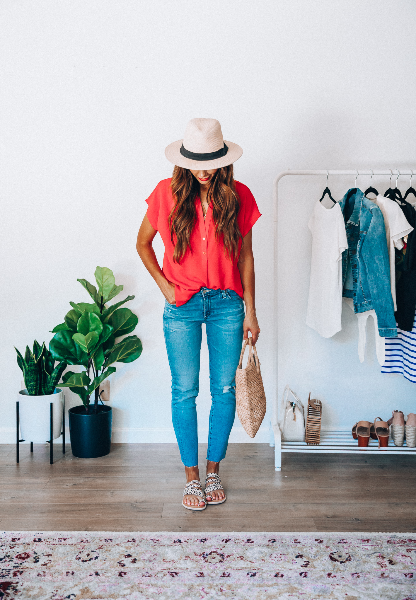 Summer Try On: Evereve Favorites by popular San Francisco fashion blog, The Girl in the Yellow Dress: image of a woman wearing a Evereve red Allison Joy Amelia Popover Top, Evereve Ag Prima Crop jeans, Evereve Dolce Vita Nelly Leopard Slide, Nordstrom Panama Hat by SOLE SOCIETY, and holding a Shopbop Hat Attack Small Round Handle Bag. 