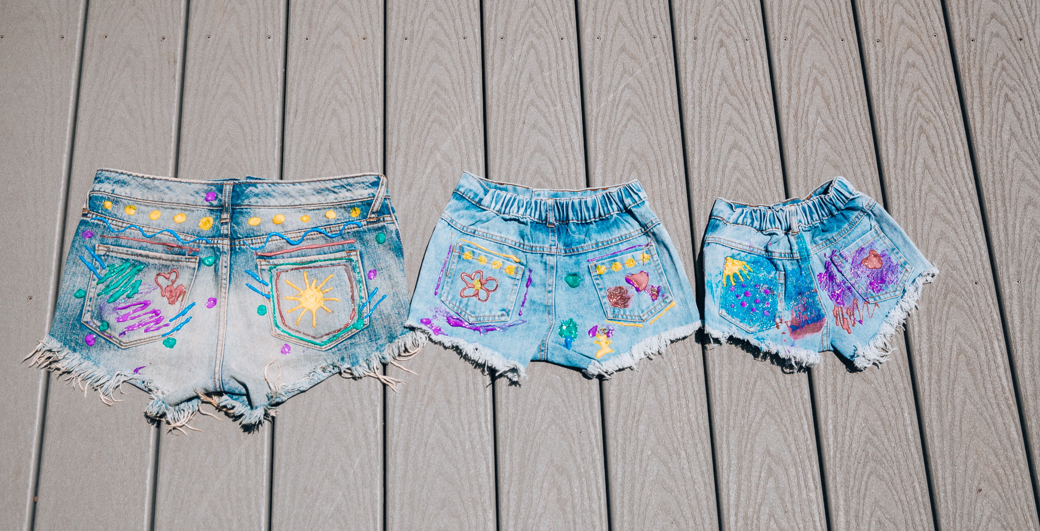 The Girl in the Yellow Dress | Latisha Springer | Fun Summer Activities for Kids by top US mom blog, The Girl in the Yellow Dress: image of cutoff denim shorts with decorative puff paint designs.