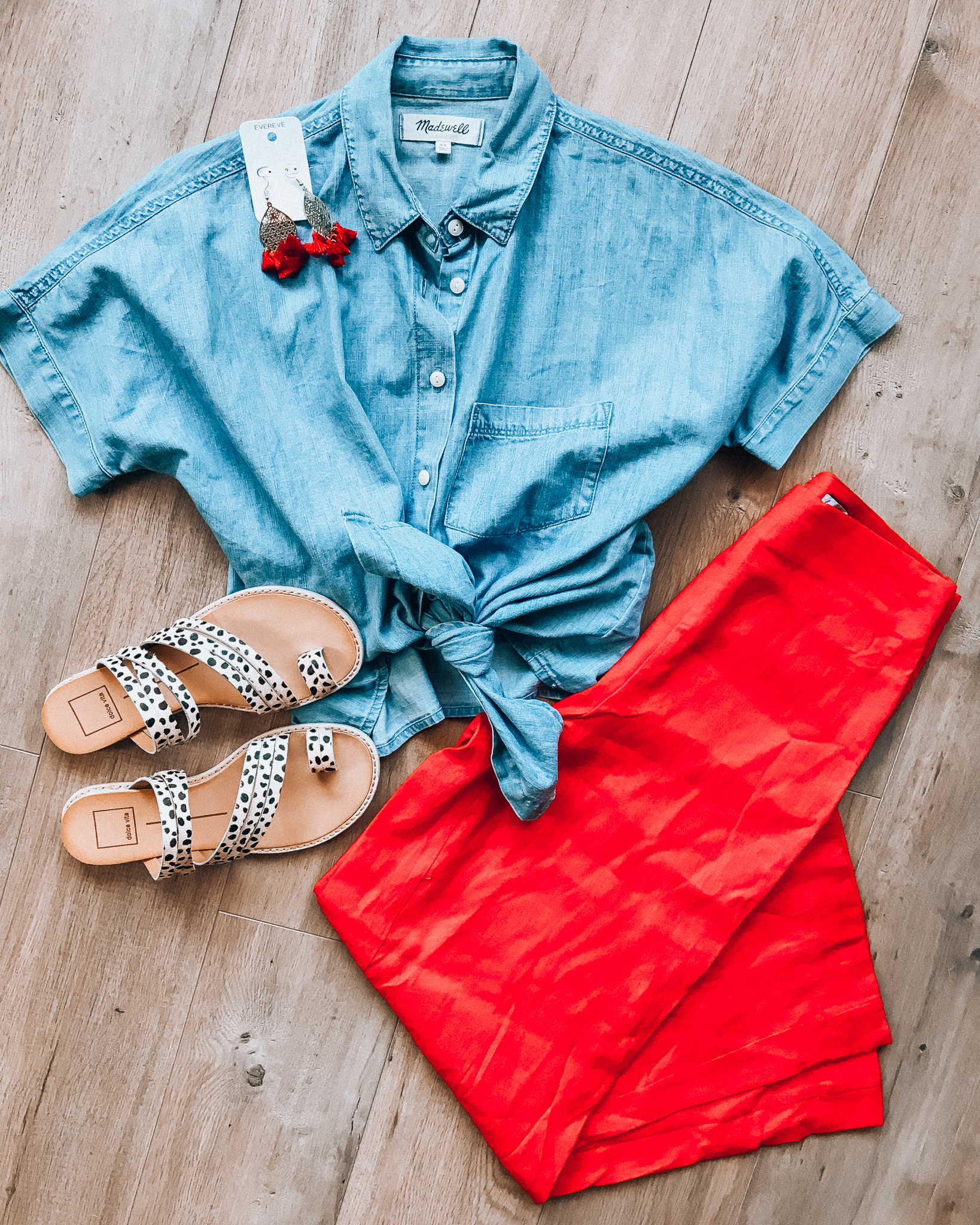 Casual Summer Outfit Ideas by popular San Francisco fashion blog, The Girl in the Yellow Dress: flat lay image of Evereve Thirty-Nine 42 Duncan Filigree Earrings, Shopbop Madewell Chambray Tie Front Shirt, Nordstrom red Leith Wide Leg Pants, and Dolce Vita Nelly Leopard Slide.  