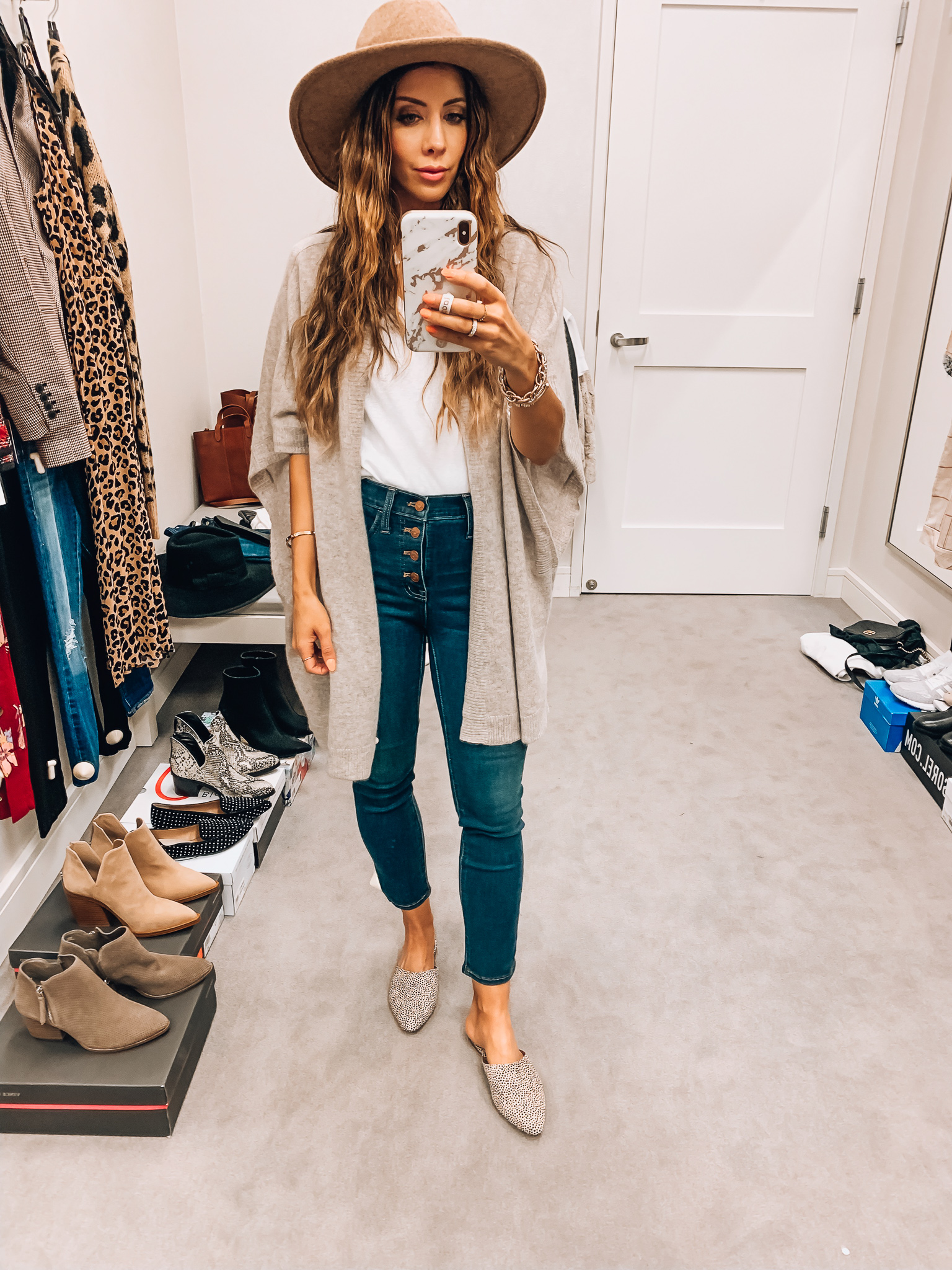 Nordstrom Anniversary Sale Early Access! by popular San Francisco fashion blog, The Girl in the Yellow Dress: image of a woman standing inside a Nordstrom dressing room wearing a Halogen Main, color, GREY DARK HEATHER Cashmere Ruana, Madewell 10-Inch High Waist Skinny Jeans: Button Front Edition, BP. V-Neck Tee, Madewell emi Genuine Calf Hair Mule, and Treasure and Bond Snakeskin Trim Wool Panama Hat.