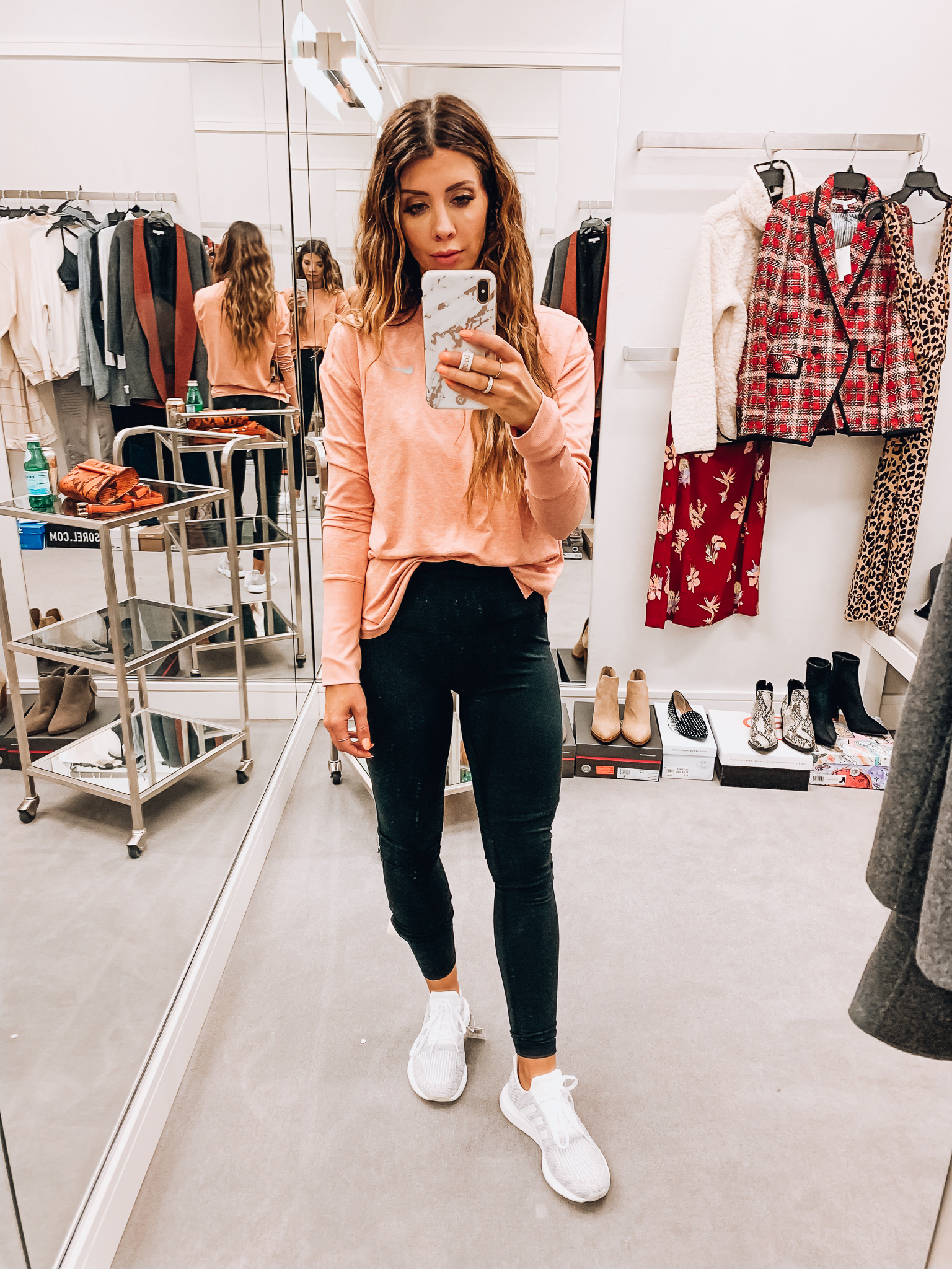 Nordstrom Anniversary Sale Early Access! by popular San Francisco fashion blog, The Girl in the Yellow Dress: image of a woman standing inside a Nordstrom dressing room wearing Adidas Swift Run Sneaker, Zella Live In High Waist Leggings, and Nike Dry Element Crewneck Top. 