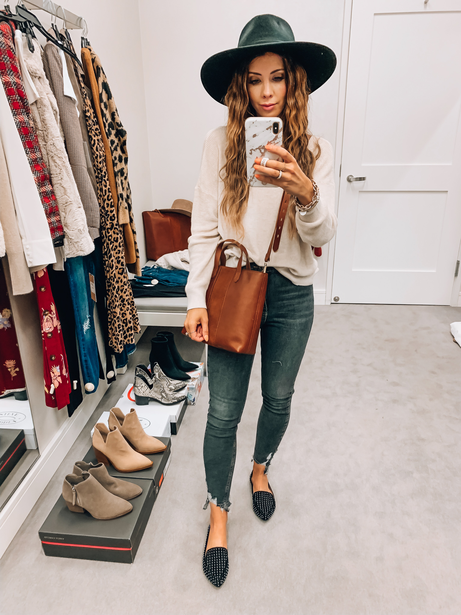 Nordstrom Anniversary Sale Early Access! by popular San Francisco fashion blog, The Girl in the Yellow Dress: image of a woman standing inside a Nordstrom dressing room wearing Brixton Joanna III Wool Felt Hat, Madewell Small Transport Leather Crossbody Tote, Steve Madden Feather Studded Loafer, Steve Madden Jamie High Waist Ripped Hem Skinny Jeans, BP. Lightweight Sweater.