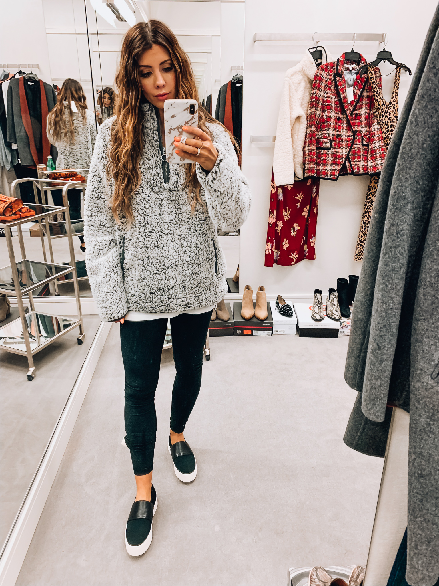 Nordstrom Anniversary Sale Early Access! by popular San Francisco fashion blog, The Girl in the Yellow Dress: image of a woman standing inside a Nordstrom dressing room wearing VInce Ward Knit Slip-On Sneaker, Zella Live In High Waist Leggings, and Thread and Supply Wubby Fleece Pullover.