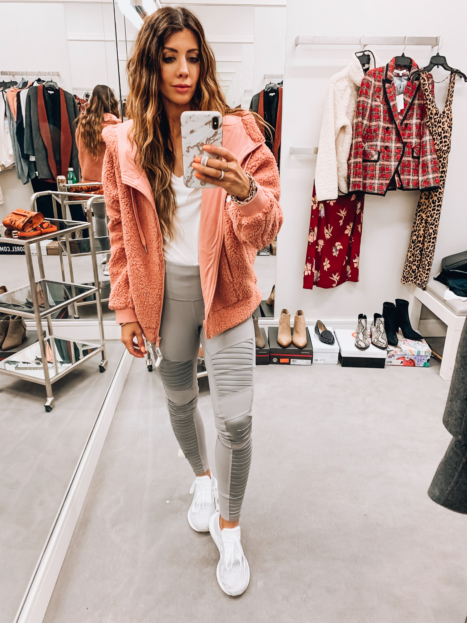 Nordstrom Anniversary Sale Early Access! by popular San Francisco fashion blog, The Girl in the Yellow Dress: image of a woman standing inside a Nordstrom dressing room wearing Adidas Swift Run Sneaker, ALO High Waist Moto Leggings, BP. V-Neck tee, and Zella Farrah Hooded Fleece Jacket. 