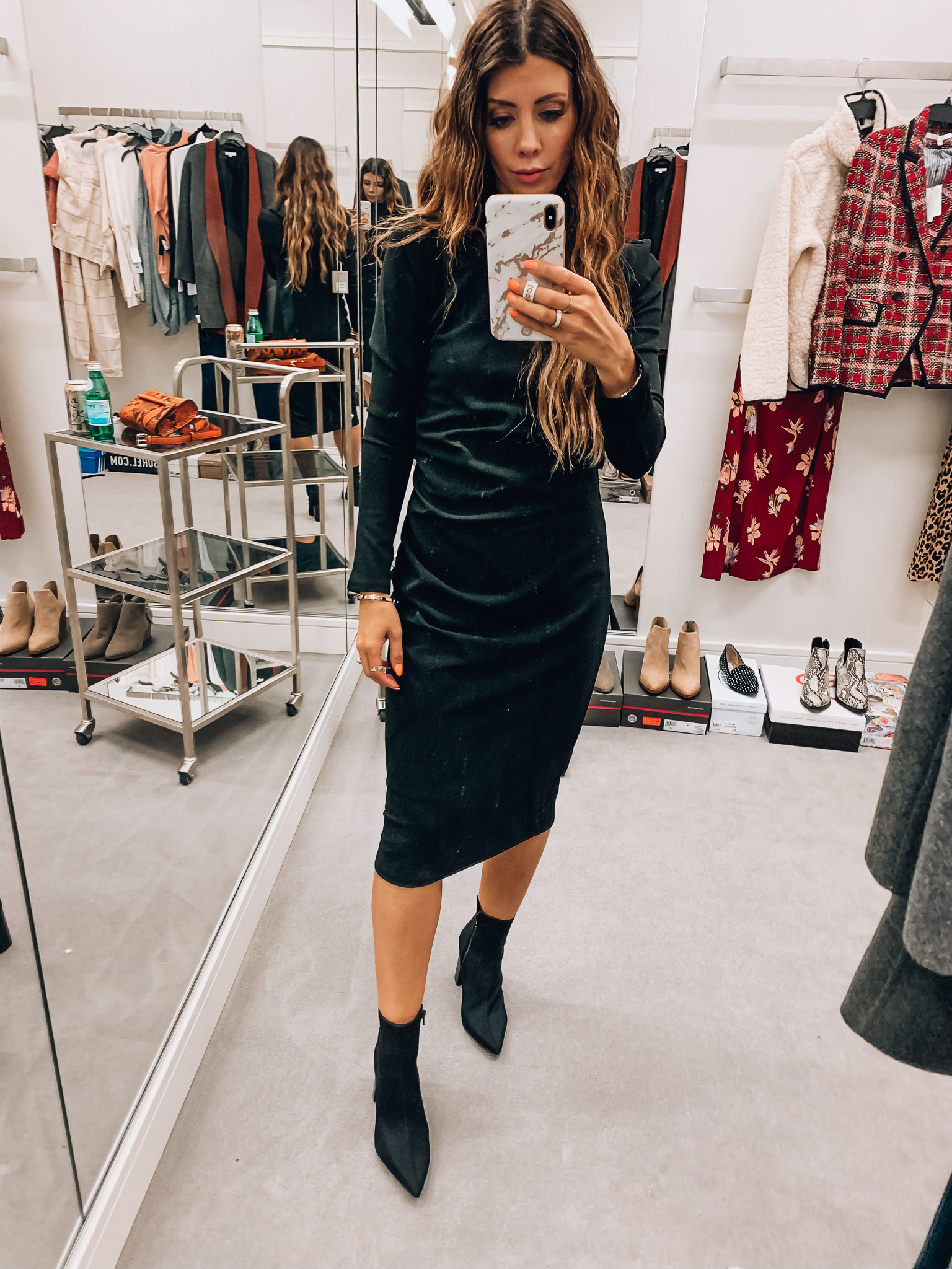 Nordstrom Anniversary Sale Early Access! by popular San Francisco fashion blog, The Girl in the Yellow Dress: image of a woman standing inside a Nordstrom dressing room wearing Jeffrey Campbell Raven Bootie and Chelsea28 Mock Neck Body-Con Dress. 