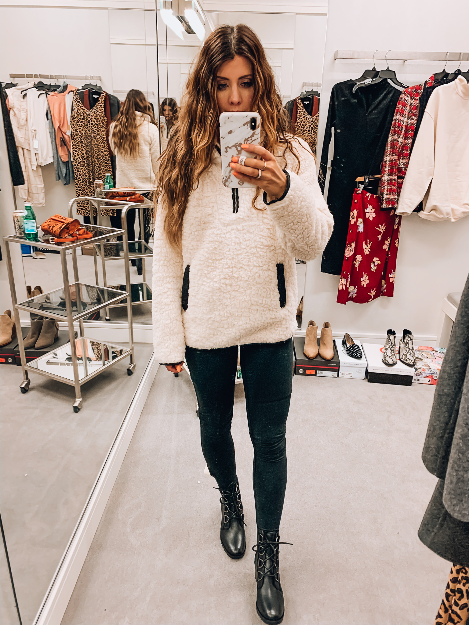 Nordstrom Anniversary Sale Early Access! by popular San Francisco fashion blog, The Girl in the Yellow Dress: image of a woman standing inside a Nordstrom dressing room wearing Thread and Supply Wubby Fleece Pullover, Zella Live In High Waist Leggings, Sorel Cate Waterproof Lace-Up Boot. 