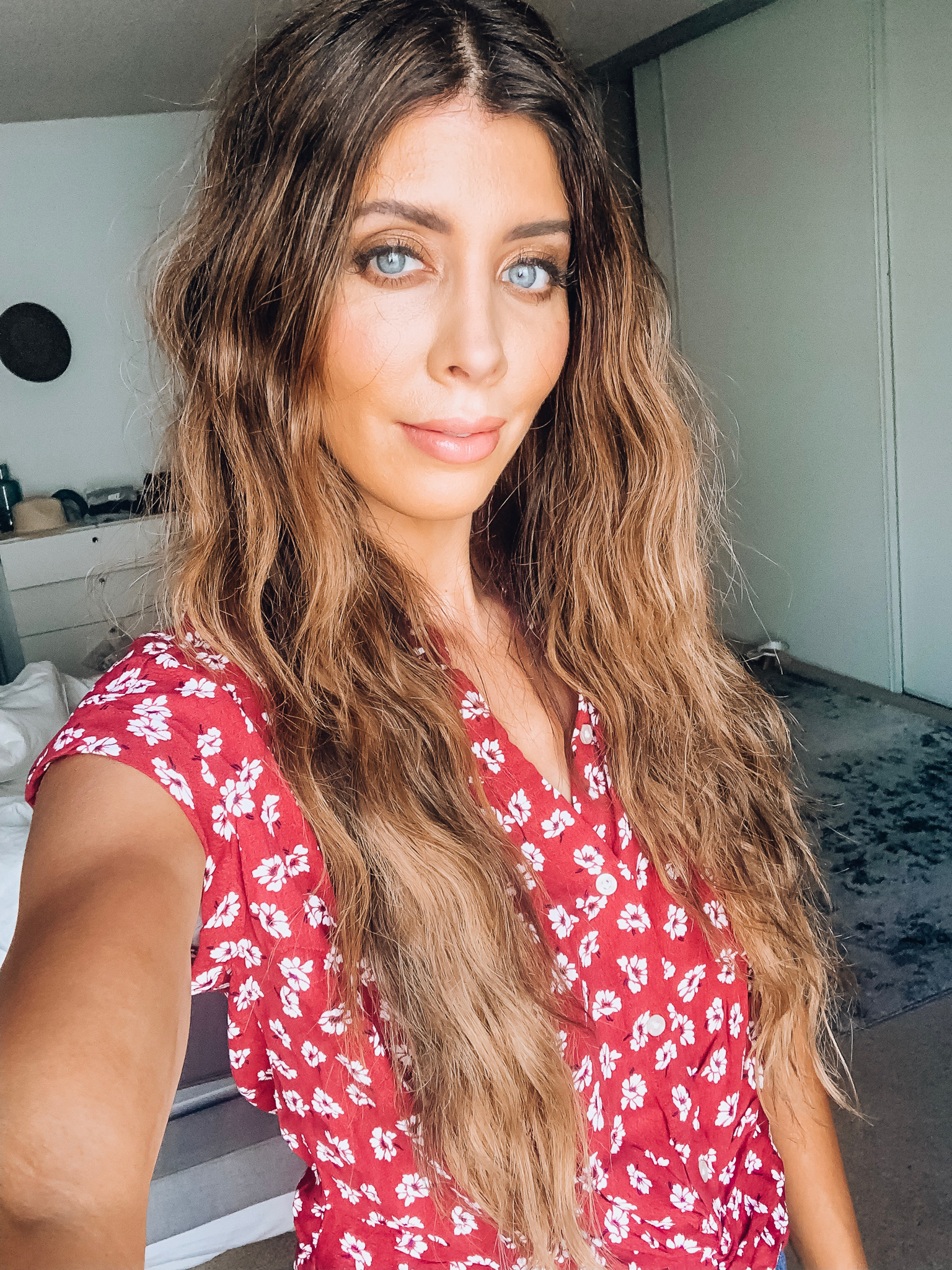 How to Use a Hair Waver + Styling Tips by popular San Francisco beauty blog, The Girl in the Yellow Dress: image of a woman with a wave hairstyle and wearing a red and white floral dress.