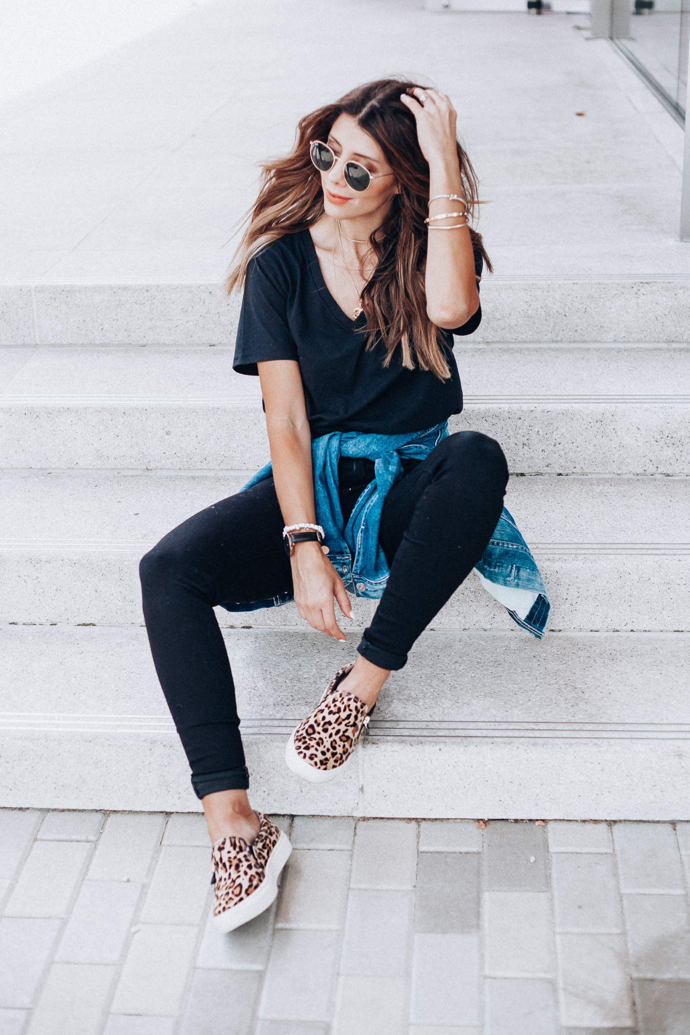 Casual Fall Outfits You'll Wear on Repeat by popular San Francisco fashion blog, The Girl in the Yellow Dress: image of a woman outside wearing a BP V-Neck Tee, Topshop Jamie High Waist Black Jeans, DR. SCHOLL'S NO CHILL PLATFORM SLIP-ON SNEAKER, Evereve Ag Mya Denim Jacket, and Icons 53mm Retro Sunglasses RAY-BAN.