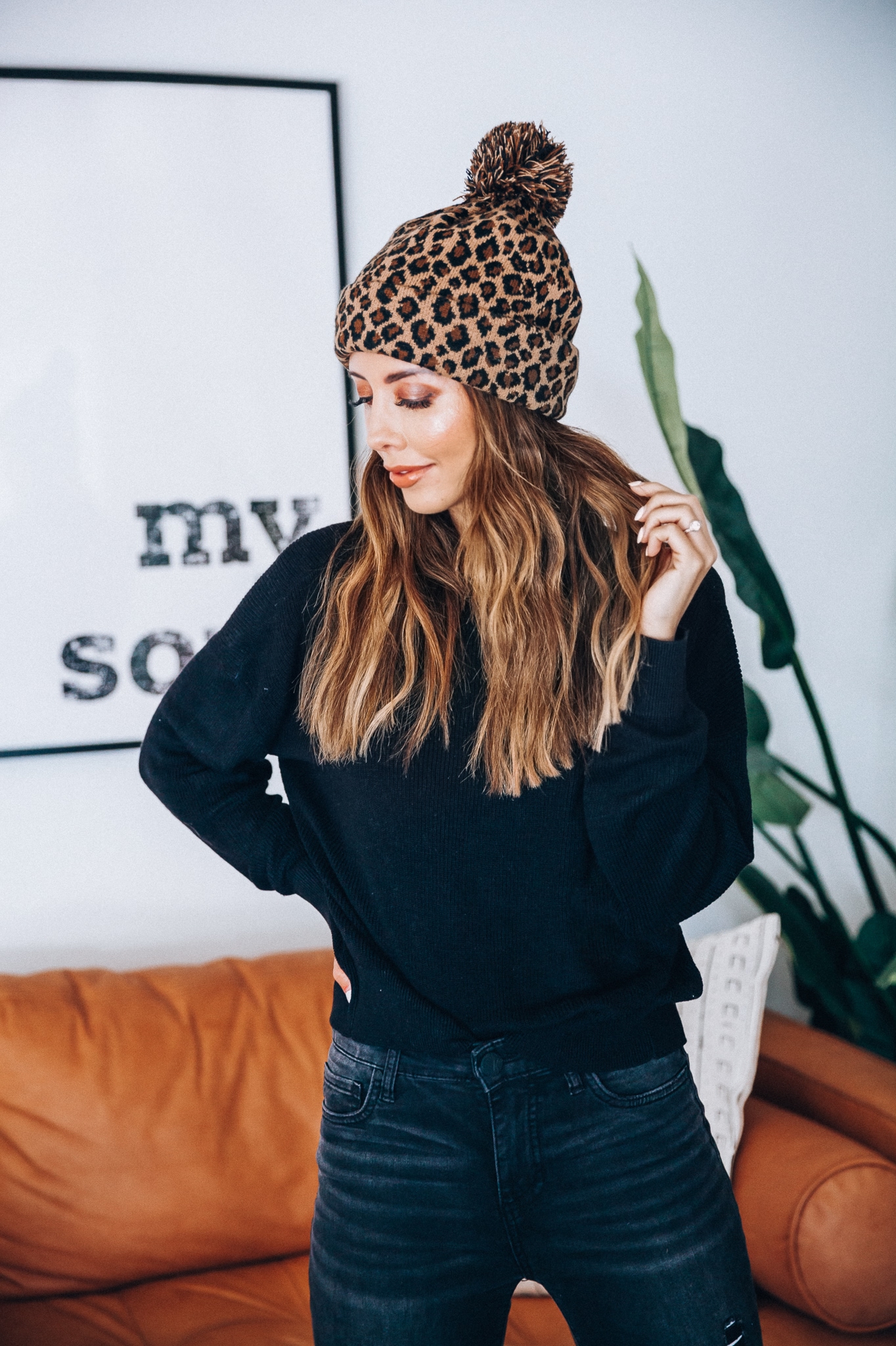 Go-To Fall Hats by popular San Francisco fashion blog, The Girl in the Yellow Dress: image of a woman wearing a leopard print beanie. 