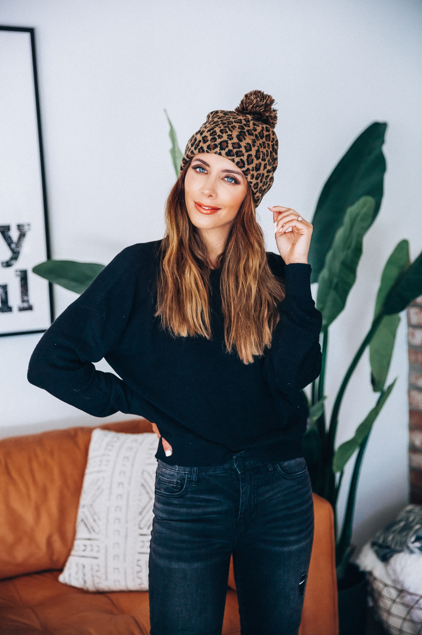 Go-To Fall Hats by popular San Francisco fashion blog, The Girl in the Yellow Dress: image of a woman wearing a leopard print beanie.