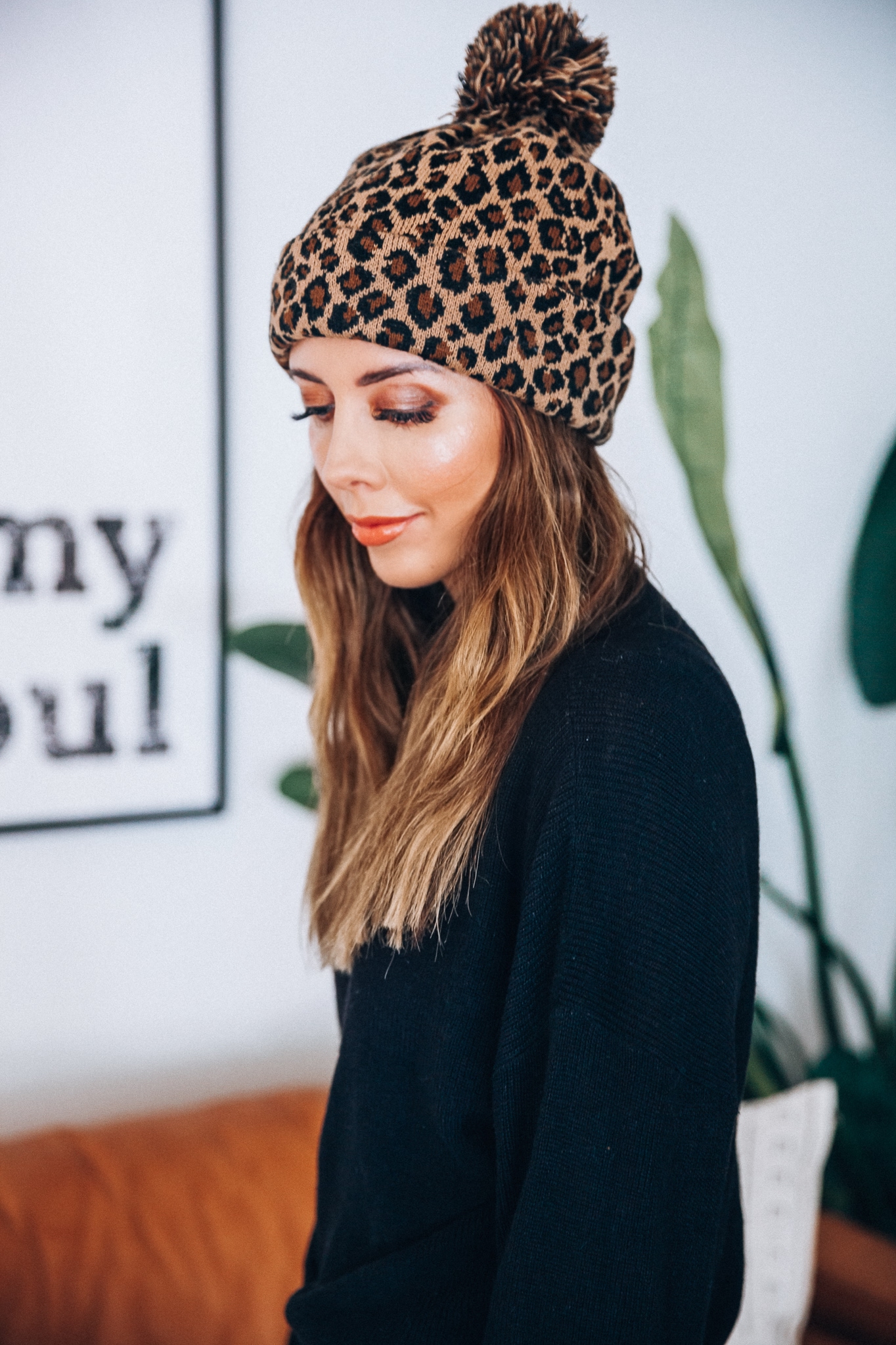 Go-To Fall Hats by popular San Francisco fashion blog, The Girl in the Yellow Dress: image of a woman wearing a leopard print beanie. 