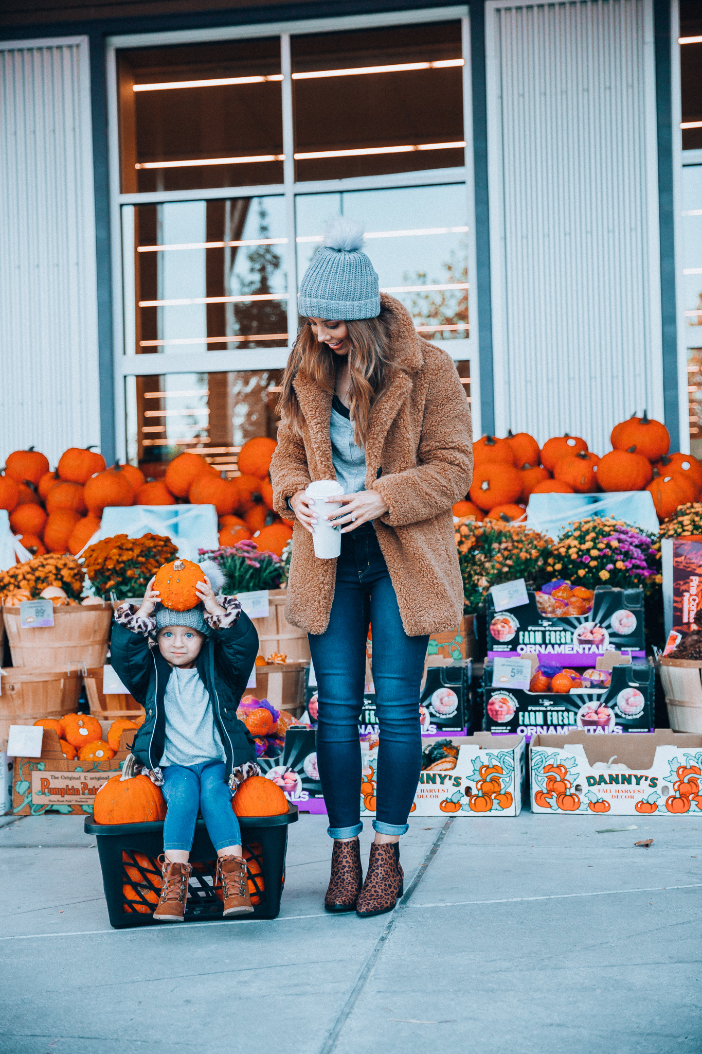 Must-Have Fall Essentials! by popular San Francisco blog, The Girl in the Yellow Dress: image of a woman and her daughter standing outside in front of a bunch of pumpkins and wearing a JcPenney Liz Claiborne Sherpa Lightweight Faux Fur Coat, JCPenney a.n.a Womens V Neck Long Sleeve Pullover Sweater, JCPenney Arizona Womens Galen Block Heel Zip Booties, JCPenney Levi's® 711™ Skinny Jeans, JCPenney Mixit Beanie, JCPenney Okie Dokie Toddler Girls Lil Adrianna Block Heel Booties, JCPenney Carter's Girls Legging, JCPenney Okie Dokie - Girls Hooded Faux Fur Trim Heavyweight Puffer Jacket, and JCPenney Web ID: 3240239 Okie Dokie Girls Round Neck Long Sleeve Sweatshirt.