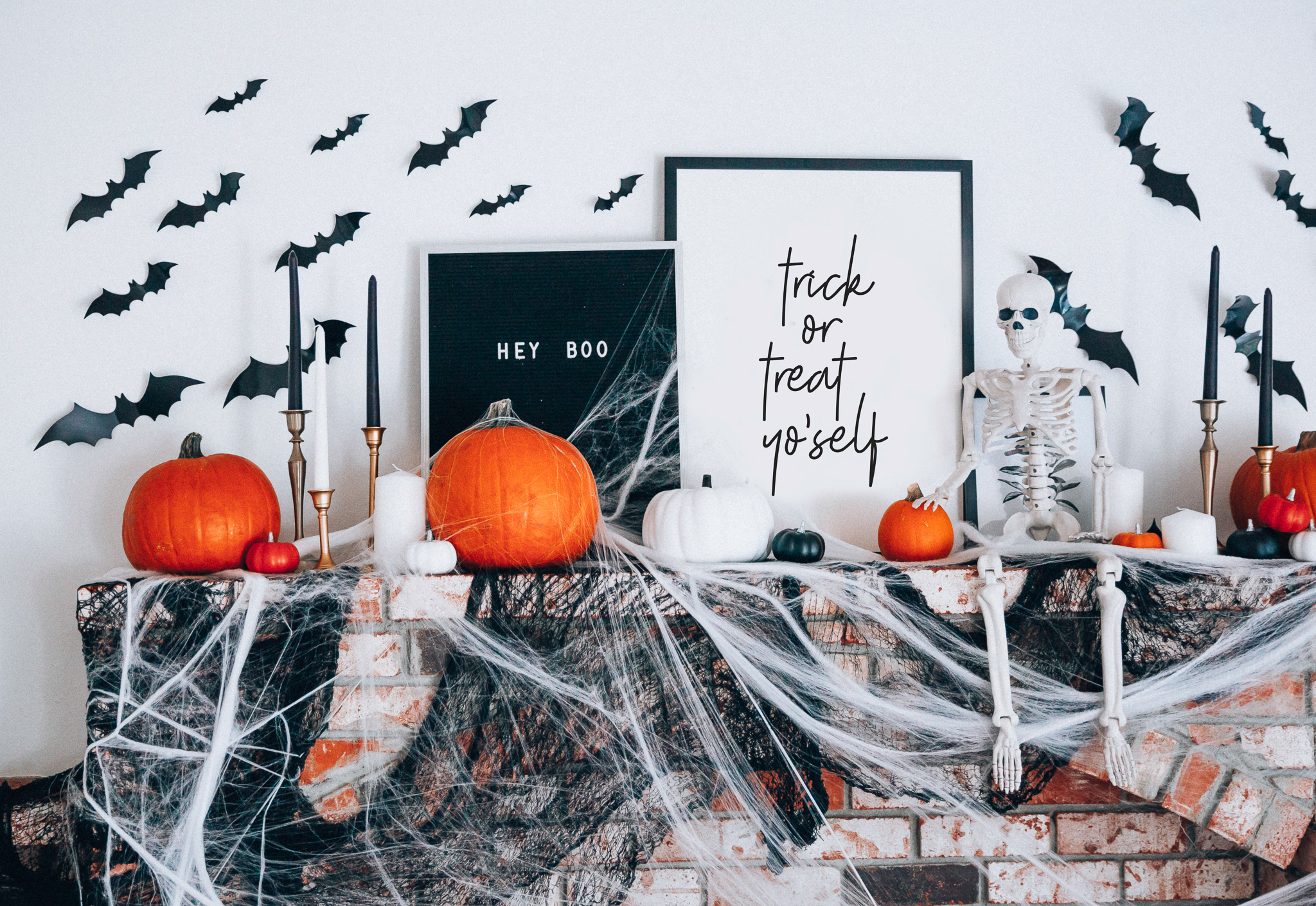 Halloween Mantel Decor + FREE Halloween Printable! by popular San Francisco lifestyle blog, The Girl in the Yellow Dress: image of fireplace mantel decorated with Target Halloween decor, pumpkins, and Amazon 3D bats.