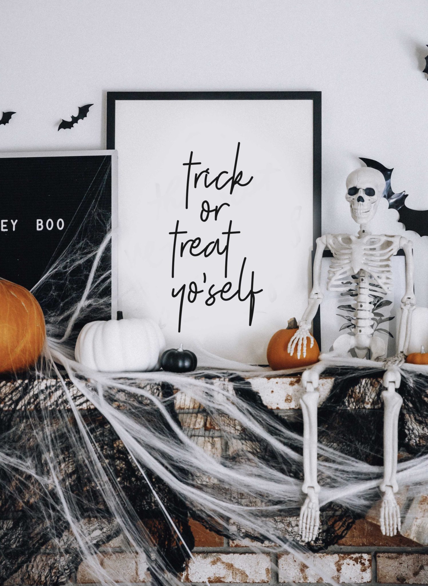 Halloween Mantel Decor + FREE Halloween Printable! by popular San Francisco lifestyle blog, The Girl in the Yellow Dress: image of fireplace mantel decorated with Target Halloween decor, pumpkins, and Amazon 3D bats.