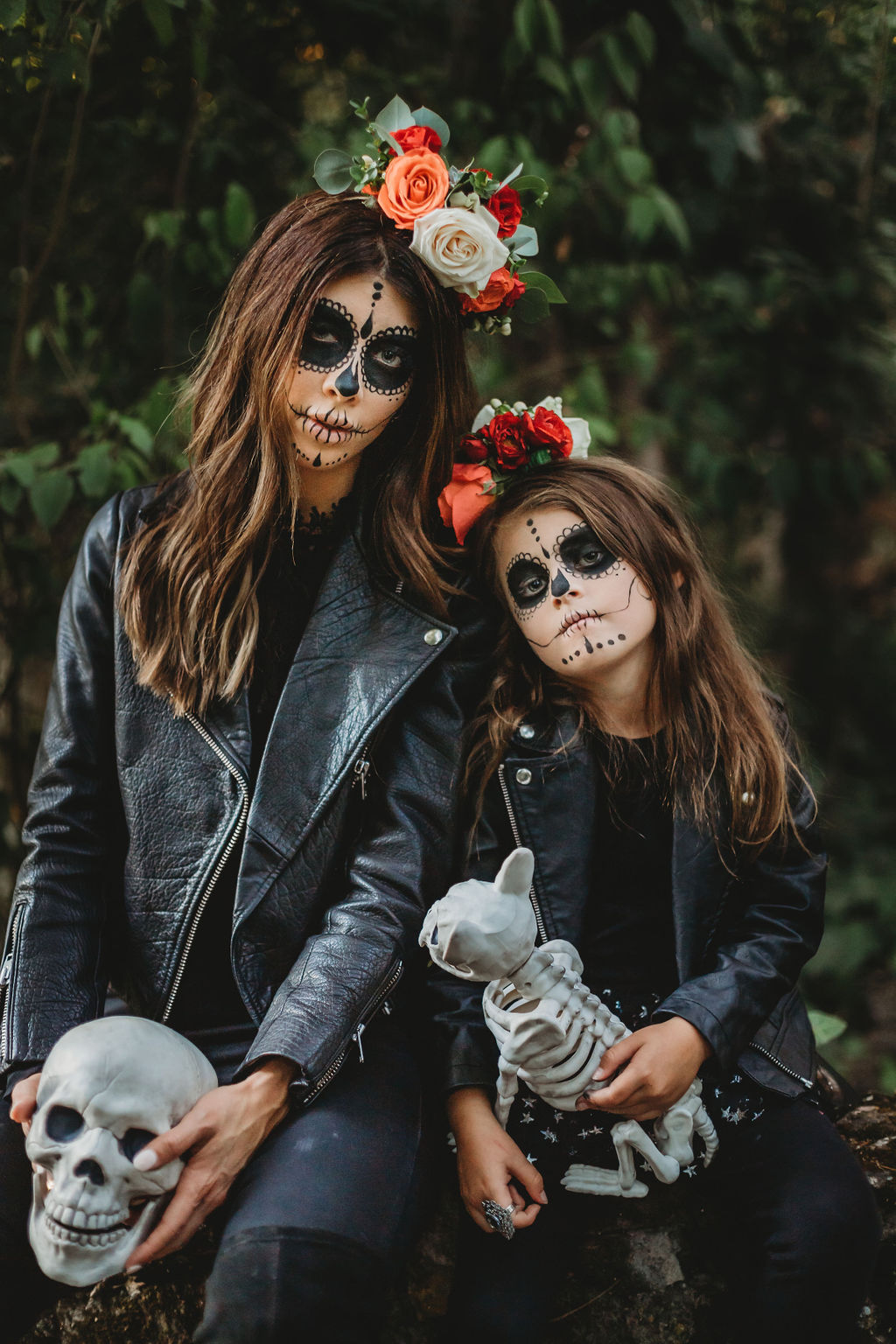 Halloween Sugar Skull Makeup by popular San Francisco beauty blog, The Girl in the Yellow Dress: image of a mom and daughter with Halloween sugar skull makeup and wearing a Gap Toddler Faux-Leather Biker Jacket, Nordstrom Tucker + Tate 'Core' Leggings, Target Cat + Jack Toddler Girls' Unity Fashion Boots, Oldnavy Crew-Neck Long-Sleeve Tee for Toddler Girls, DOMIRY Tulle Tutu Skirt for Little Girls Layered Sparkle Star Princess Ballet Dance Dress Puffy Skirt, Nordstrom BLANKNYC Tonal Star Faux Leather Moto Jacket, Nordstrom Steve Madden Jacey Over the Knee Boot, Nordstrom TopShop Joni High Waist Jeans, and ShopBop WAYF Berklin Lace Top and holding a Target Hide and Eek! Boutique Chihuahua Skeleton Decorative Halloween Prop.
