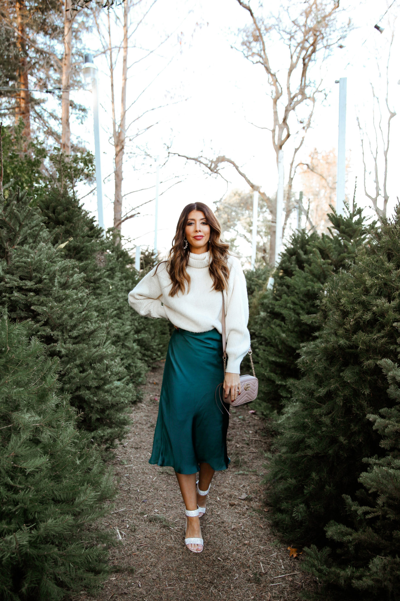 New Year's Eve Party Outfits by popular San Francisco fashion blog, The Girl in the Yellow Dress: image of a woman outside wearing Nordstrom Jeffrey Campbell Lindsay Sandals, Nordstrom Leith Satin Midi Skirt, and H&M Rib-knit Skirt.