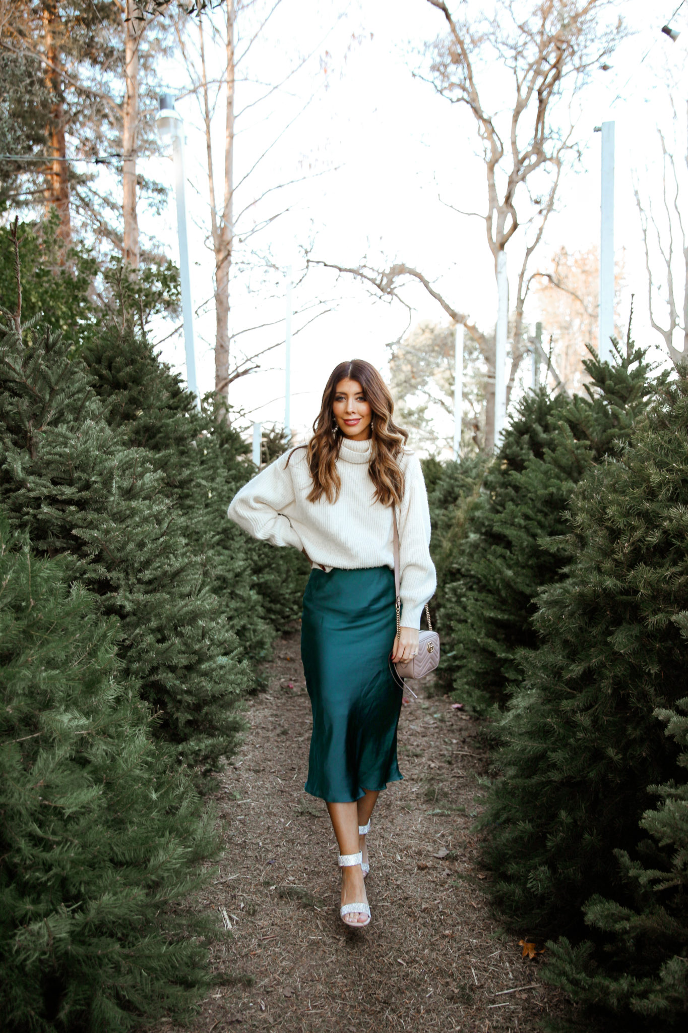 New Year's Eve Party Outfits by popular San Francisco fashion blog, The Girl in the Yellow Dress: image of a woman outside wearing Nordstrom Jeffrey Campbell Lindsay Sandals, Nordstrom Leith Satin Midi Skirt, and H&M Rib-knit Skirt.