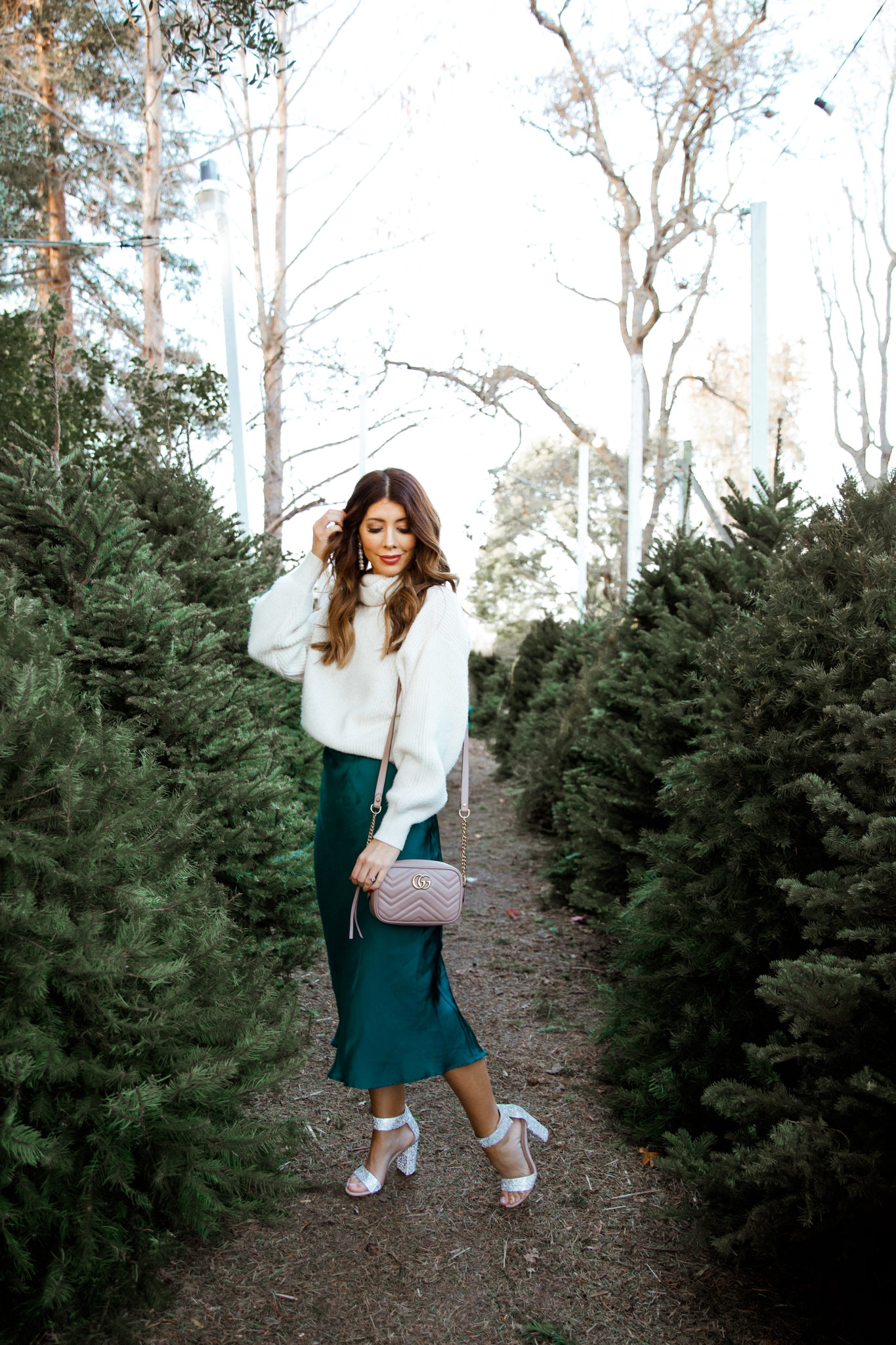 New Year's Eve Party Outfits by popular San Francisco fashion blog, The Girl in the Yellow Dress: image of a woman outside wearing Nordstrom Jeffrey Campbell Lindsay Sandals, Nordstrom Leith Satin Midi Skirt, and H&M Rib-knit Skirt.