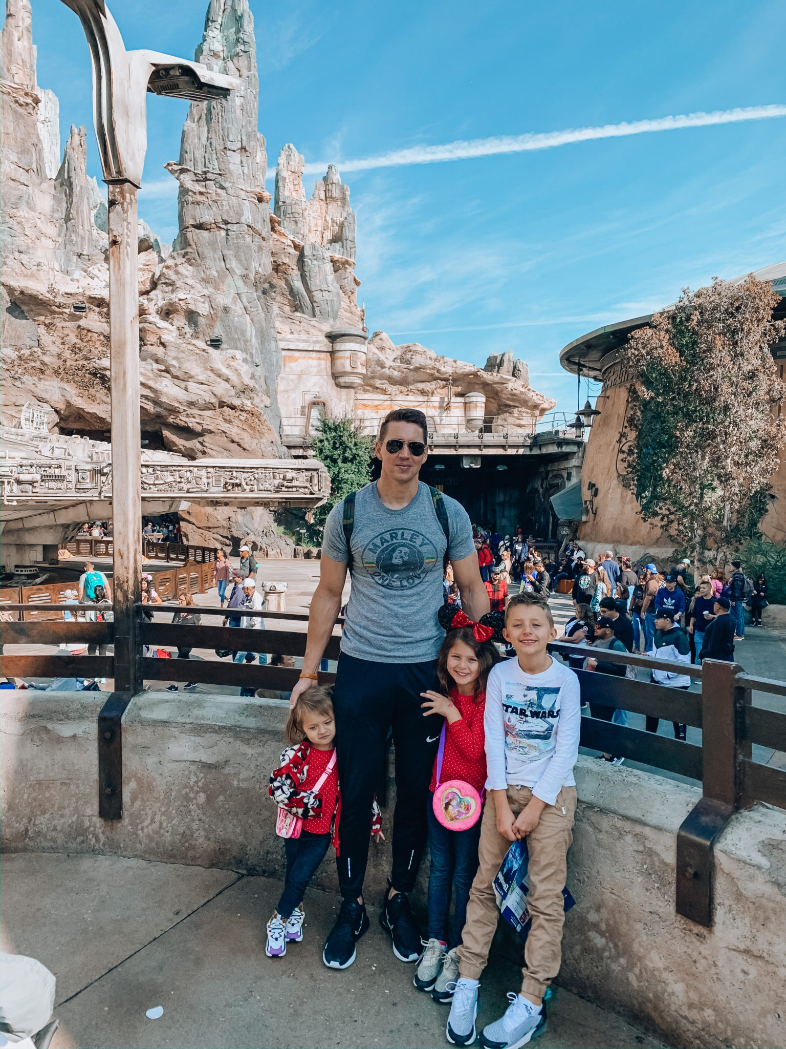 Disneyland Tips for Families! by popular San Francisco life and style blog, The Girl in the Yellow Dress: image of a family at Disneyland.