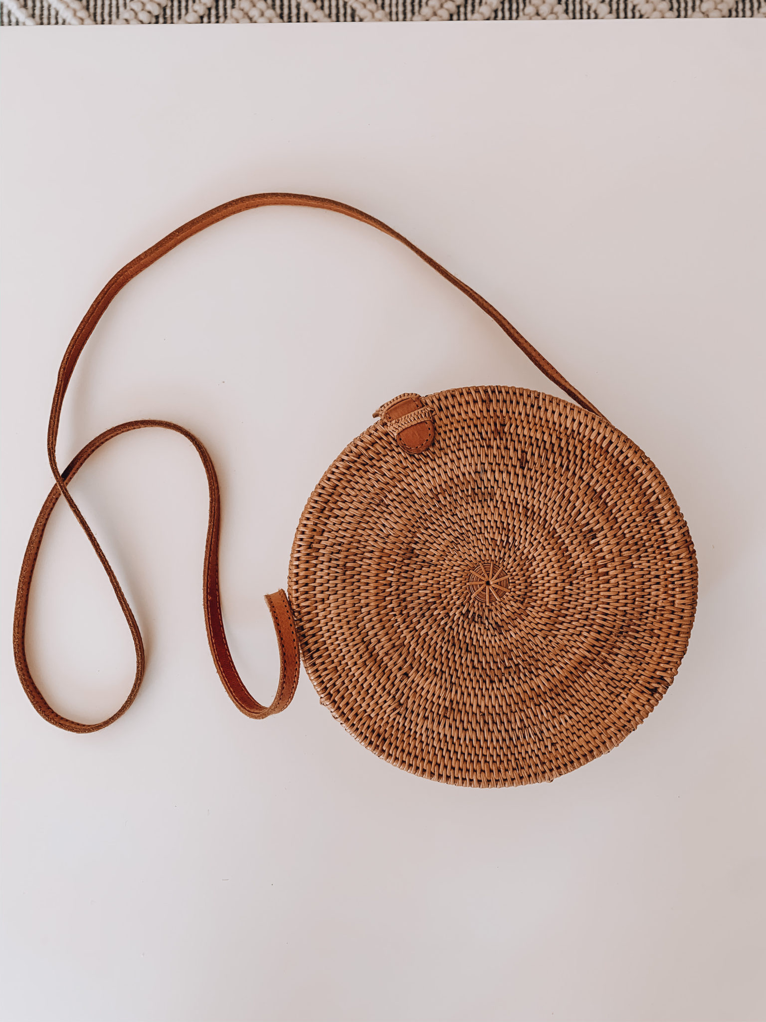 Amazon Favorites by popular San Francisco life and style blog, The Girl in the Yellow Dress: image of a Amazon Handwoven Round Rattan Bag Shoulder Leather Straps Natural Chic Hand NATURALNEO.