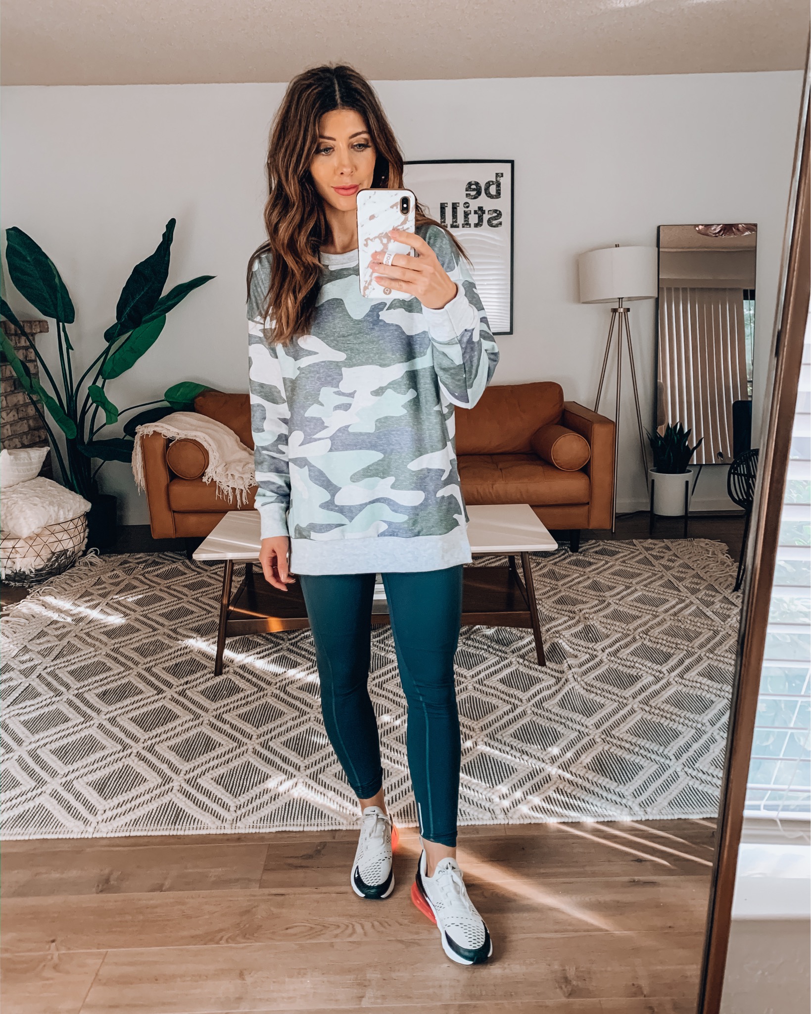 Amazon Favorites by popular San Francisco life and style blog, The Girl in the Yellow Dress: image of a woman wearing a Amazon ECOWISH Women's Camouflage Print Casual Leopard Pullover, Amazon CRZ YOGA Women's High Waisted Yoga Pants with Pockets, and Nike Air Max 270.